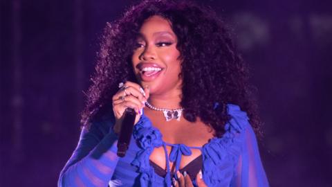 SZA performing on the Pyramid Stage at the Glastonbury Festival at Worthy Farm in Somerset.