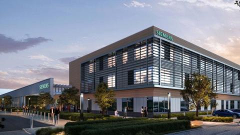 An artist impression of the outside of the new building. It is part cladded in wood and includes a grey exterior. Siemens is written in large light teal on the top of the building. Trees and greenery has been planted outside the building.