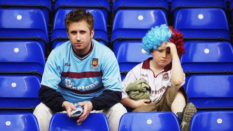 West Ham fans look dejected in their seats