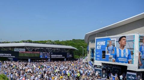 Brighton fans outside the American Express Stadium