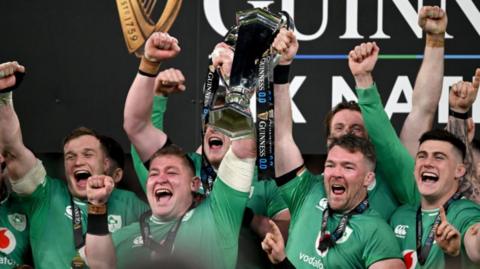 Ireland players lift the Six Nations trophy in 2024