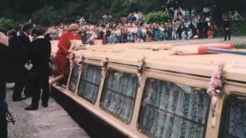 Diana, Princess of Wales, wearing a red outfit as she boarded the Judith Mary II narrowboat in Whaley Bridge in June 1990