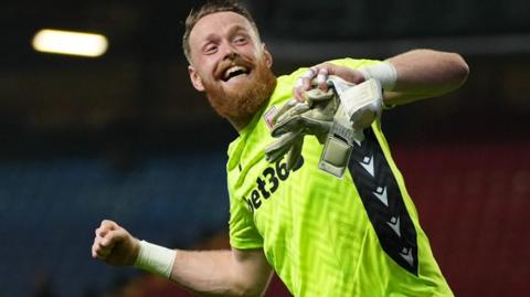 Stoke goalkeeper Viktor Johansson celebrates victory over Blackburn