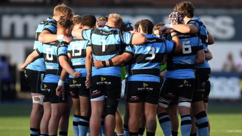 Cardiff players in a huddle