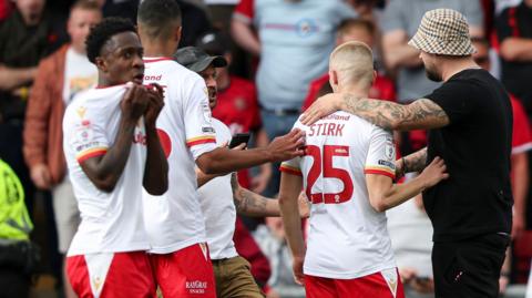 Walsall players look dejected at full-time