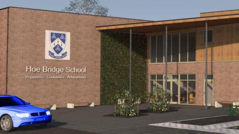 A CGI image showing a building and car park of Hoe Bridge Schools' expansion building plans. The building in the image is red brick with a plant wall. A blue car is in the foreground. 