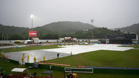 Covers on the pitch during a rain delay at the Daren Sammy cricket ground in St Lucia