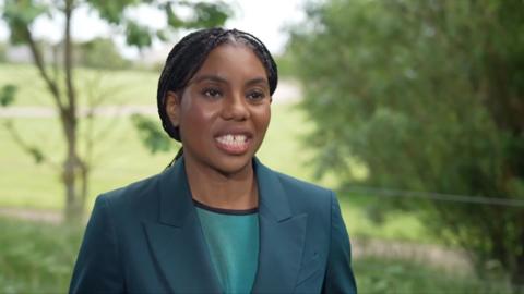 Kemi Badenoch in a blue suit