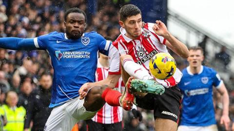 Millenic Alli of Portsmouth and Ross Stewart of Southampton challenging for the ball in last season's derby at Fratton Park