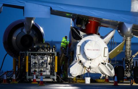 Technicians work on Virgin Orbit's LauncherOne rocket in Cornwall