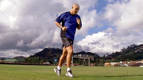 Ronaldo jogging on a football pitch