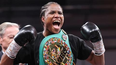 Caroline Dubois celebrates with her WBC lightweight title