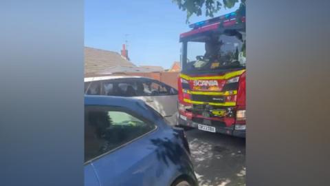 A fire engine struggles to pass cars in Formby on Bank Holiday Monday 25 May 2026.