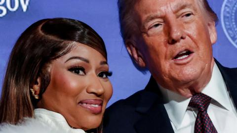 US President Donald Trump and musician Nicki Minaj stand together onstage at the US Treasury Department's Trump Accounts Summit, in Washington DC