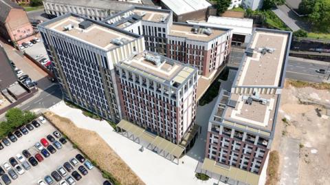 A drone shot shows the recently-completed blocks of Winfield Court