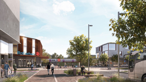 A mock-up of outside the station from ground level. There are modern buildings and paved areas with benches. There are also cycle paths and spaces for coaches. The area is decorated by plants and trees.