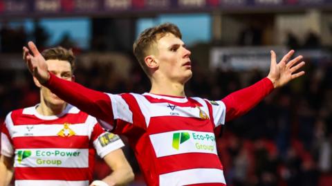 Rob Street celebrates a goal for Doncaster