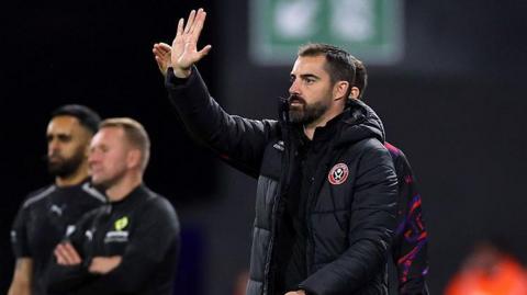 Ruben Selles signals to his Sheffield United players from the touchline at Portman Road