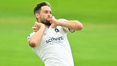 Chris Woakes bowling for Warwickshire