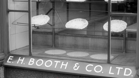 Empty shop window in Blackburn duirng Wakes Week as sown in 1957 BBC documentary.