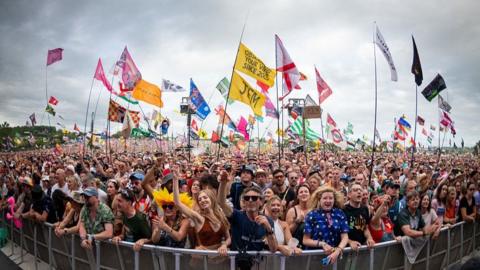 a crowd at glastonbury, as seen from the stage.