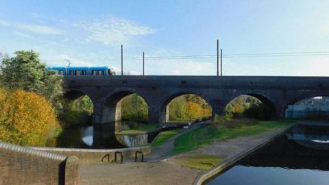 A visualisation of a West Midlands Metro tram crossing Parkhead viaduct, showing a tram crossing the bridge structure with pathways, water and shrubs in the foreground, and overhead lines above the viaduct, under a blue sky.