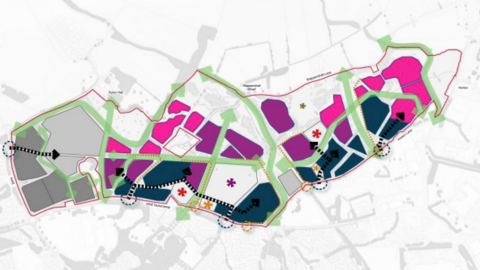 A picture of plans for the development on a map. It is outlined by a red line, and contains squares of different colours, signifying areas of the development. They are light grey, dark grey, pink, purple and dark blue. There are black dotted arrows to show entry points