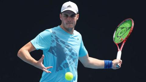 Henry Patten prepares to play a forehand