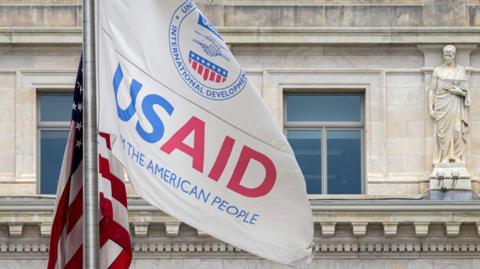 A flag outside USAID headquarters in Washington, DC