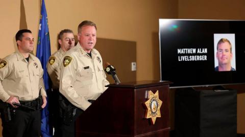 A photo of Matthew Alan Livelsberger is shown as Sheriff Kevin McMahill talks to the news media at Metropolitan Police Department headquarters in Las Vegas on Thursday, Jan. 2, 2025