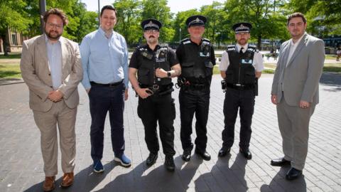 Three police officers, in uniform, standing with Tees Valley Mayor Ben Houchen, Middlesbrough Mayor Chris Cooke and Police and Crime Commissioner Ben Storey.
