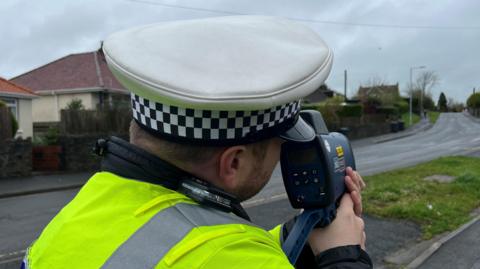 Police officer with speed gun