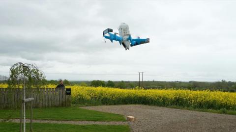 Amazon's MK30 drone dropping off a parcel