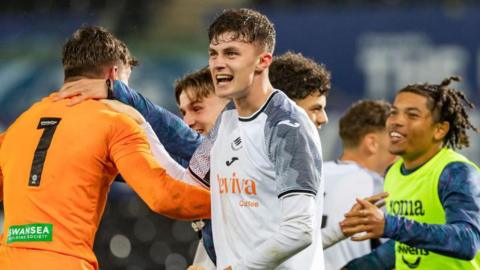 Joe Thomas celebrating a Swansea under-23s win