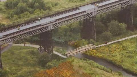 An artist's impression shows a bridge by the historical viaduct 
