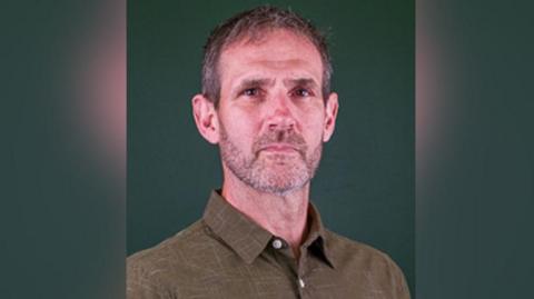 Ivan Dabbs wearing a shirt in his official West Northamptonshire council photograph