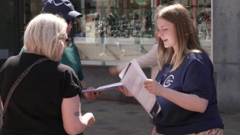 A member of the inquiry team talks to people in Blackpool