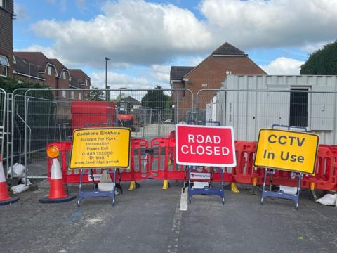 Roadwork barriers block a street in Godstone High Street