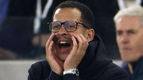 Liam Rosenior with hands held up to his face