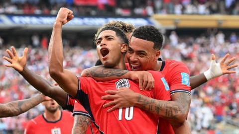 England players celebrating after Bellingham's goal against Panama.