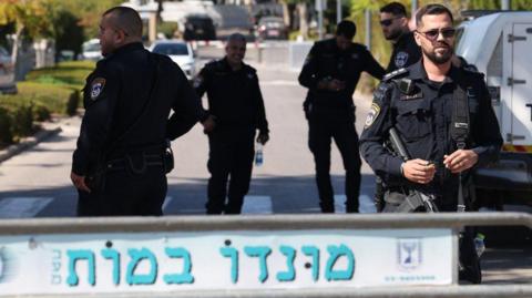 Israeli police guard on the site of a reported drone attack in the northern Israeli town of Caesarea. Photo: 19 October 2024