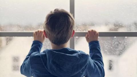 Boy in window