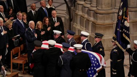 US Presidents react as the casket of Jimmy Carter is carried away