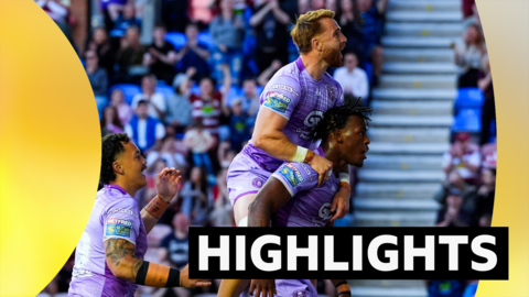Wigan players celebrating a try against Leigh