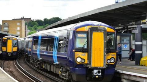A Southeastern train at a station platform.