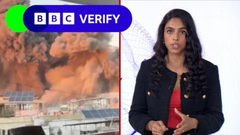 ˿ reporter Merlyn Thomas in front of footage of bombed buildings