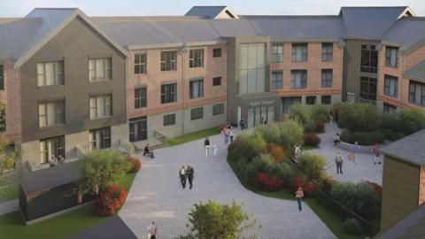 An artist's impression of the planned care home. It has three storeys and is made of brick and black boarding. It looks onto a courtyard which people are walking across and where there are grassy areas with red flowering shrubs. 
