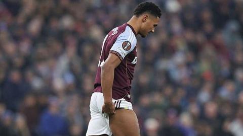 Ollie Watkins holds his hamstring