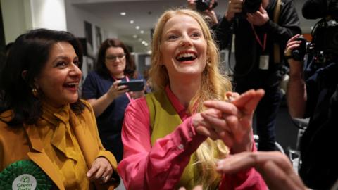 Hannah Spencer grins as she celebrates