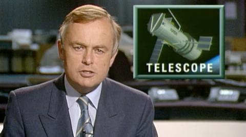 Martyn Lewis in studio, with an insert picture of the Hubble Space Telescope